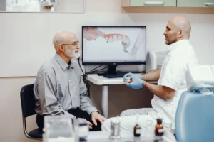 Patient discussing premium dentures during a free consultation near me at Montana Center for Implants and Dentures.