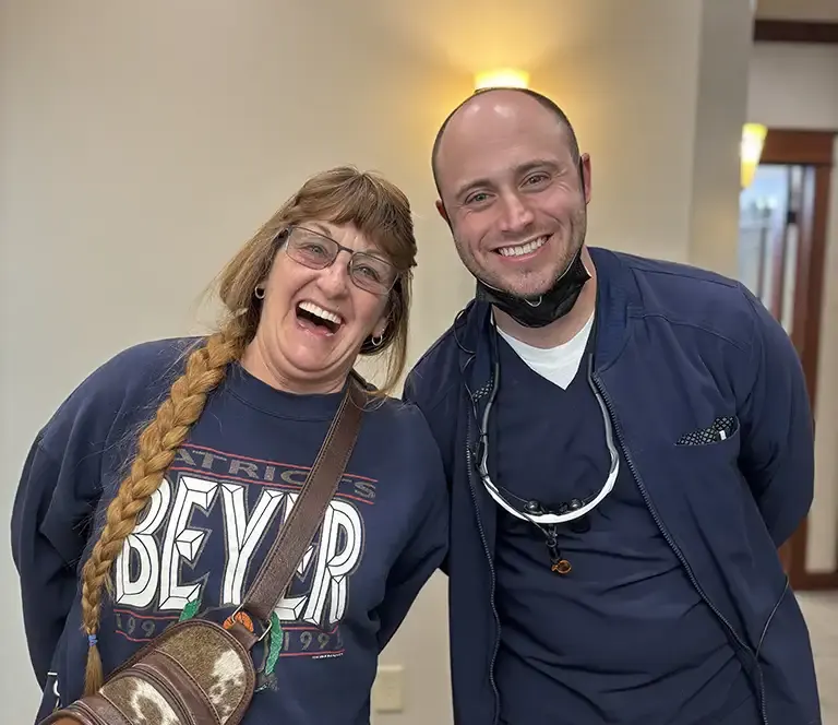 Dr. Townsend smiling with a Montana Center for Implants and Dentures patient discussing full & partial dentures in Billings, MT